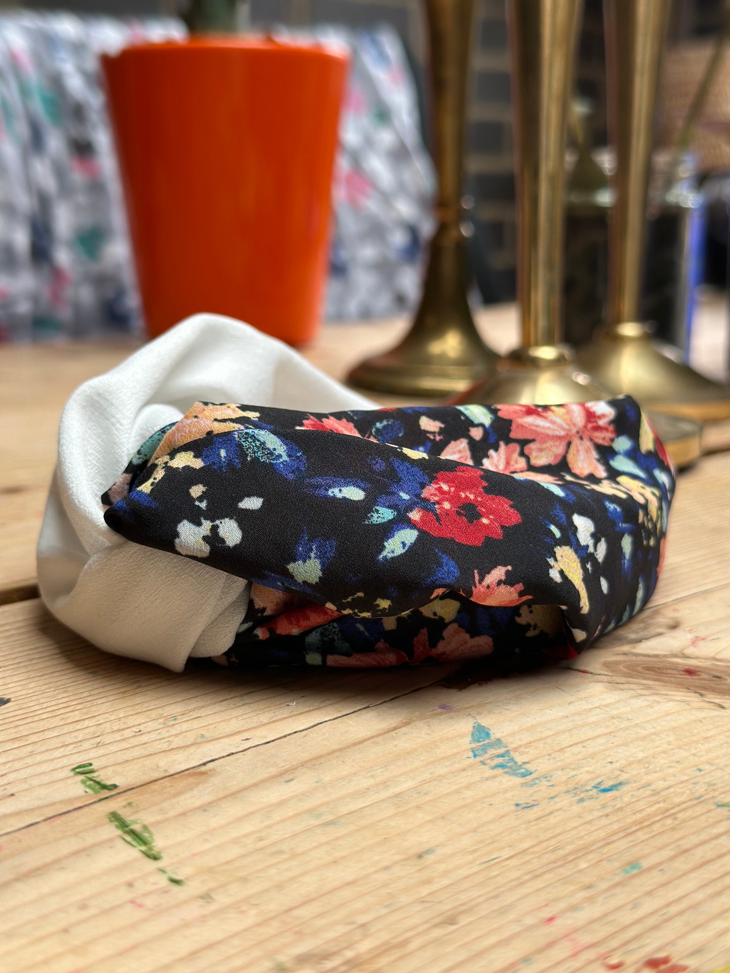 Black, burnt orange and red, and blue floral turban-twist with cream linen