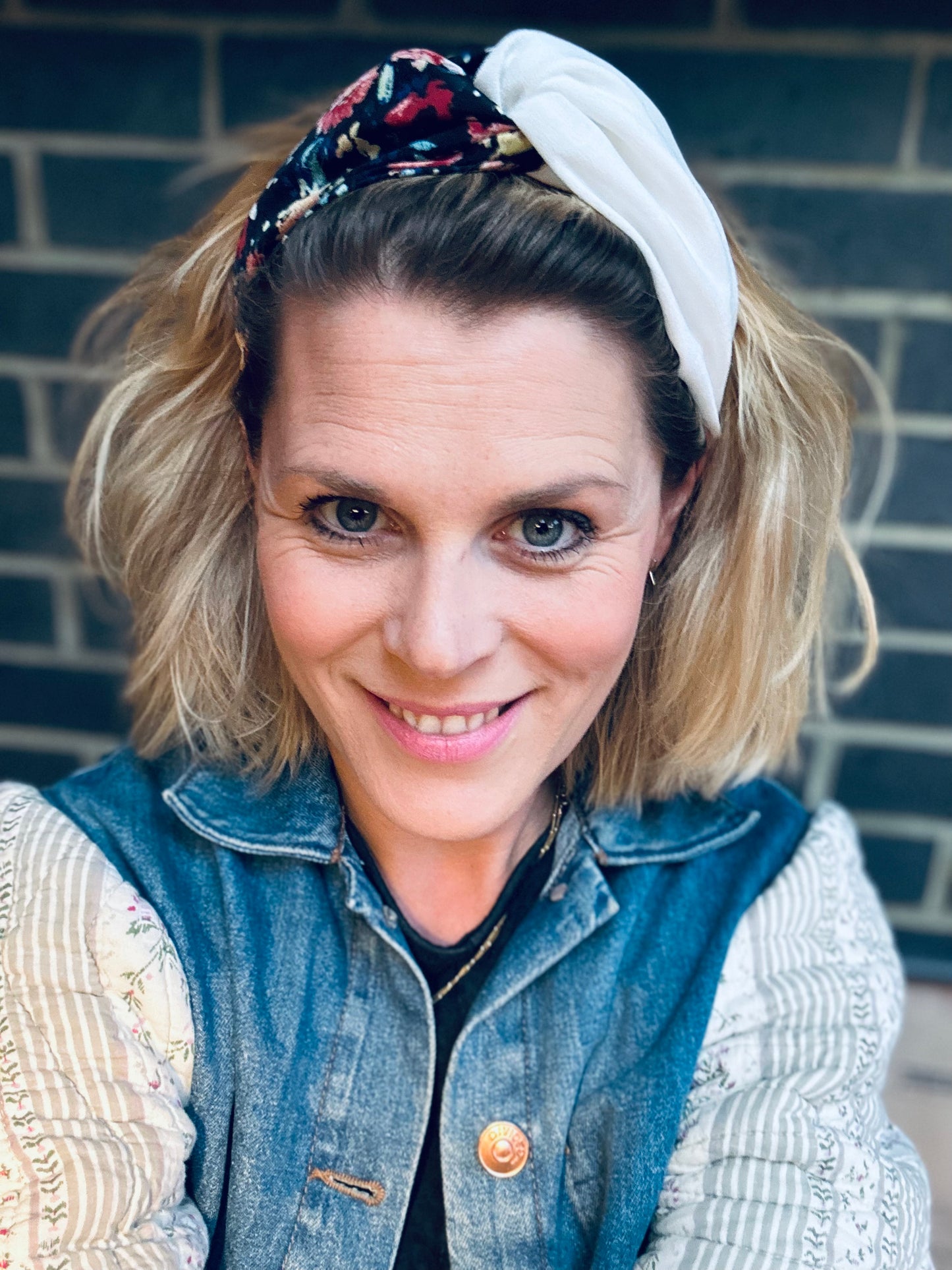 Black, burnt orange and red, and blue floral turban-twist with cream linen