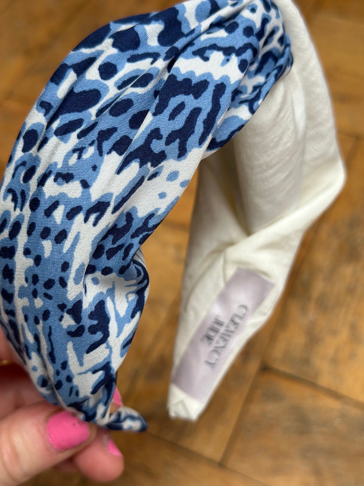 Turban style twist hairband cream and blue snakeskin