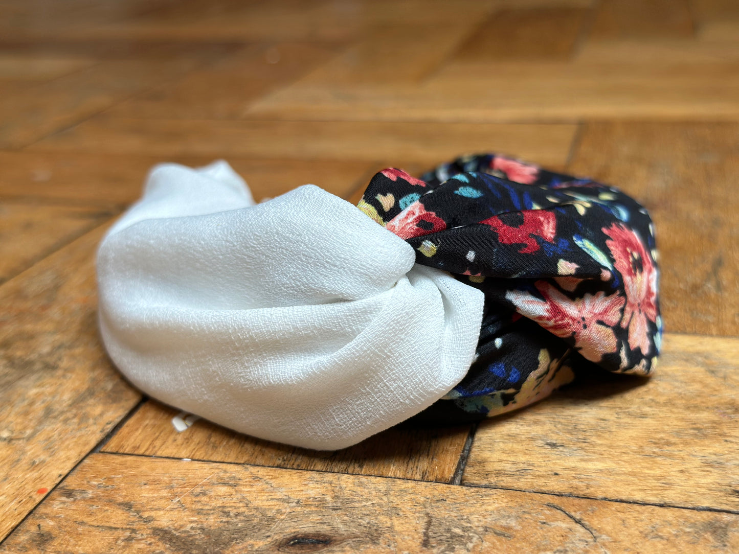 Black, burnt orange and red, and blue floral turban-twist with cream linen