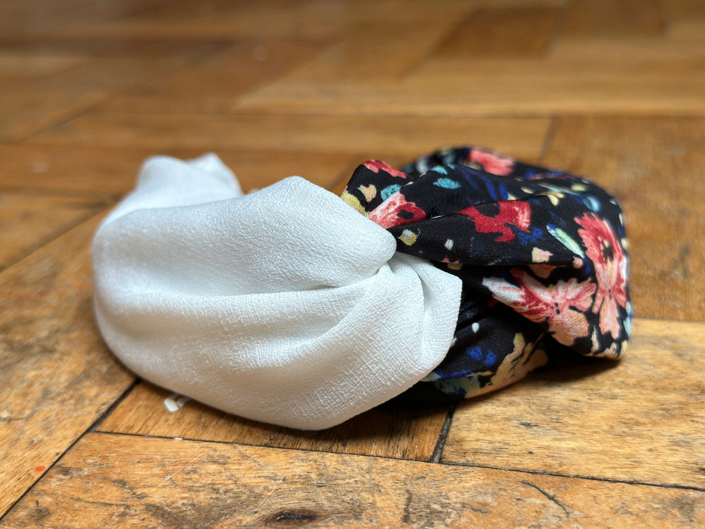 Black, burnt orange and red, and blue floral turban-twist with cream linen