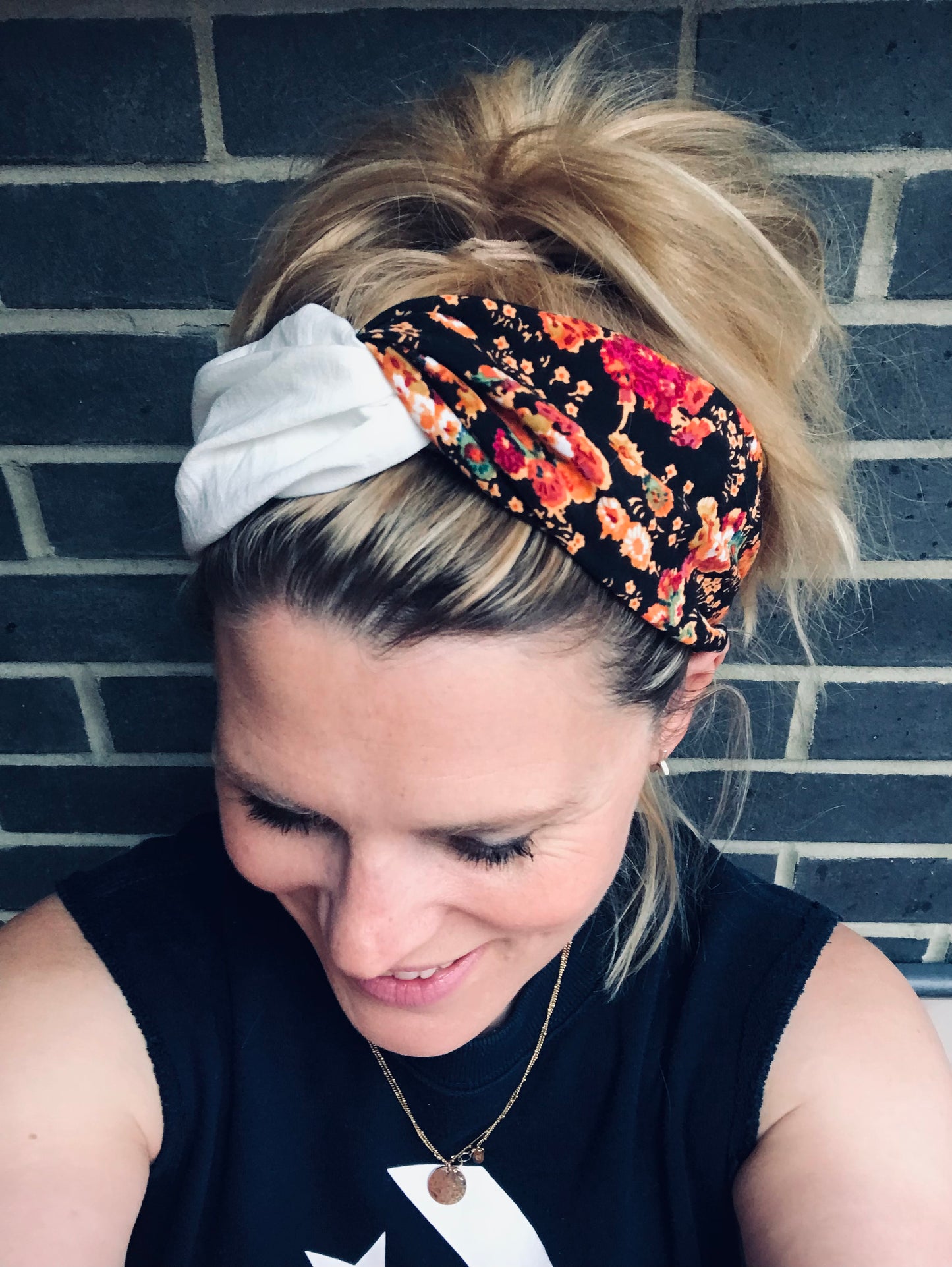 Turban style twist black and orange flowers with cream silk