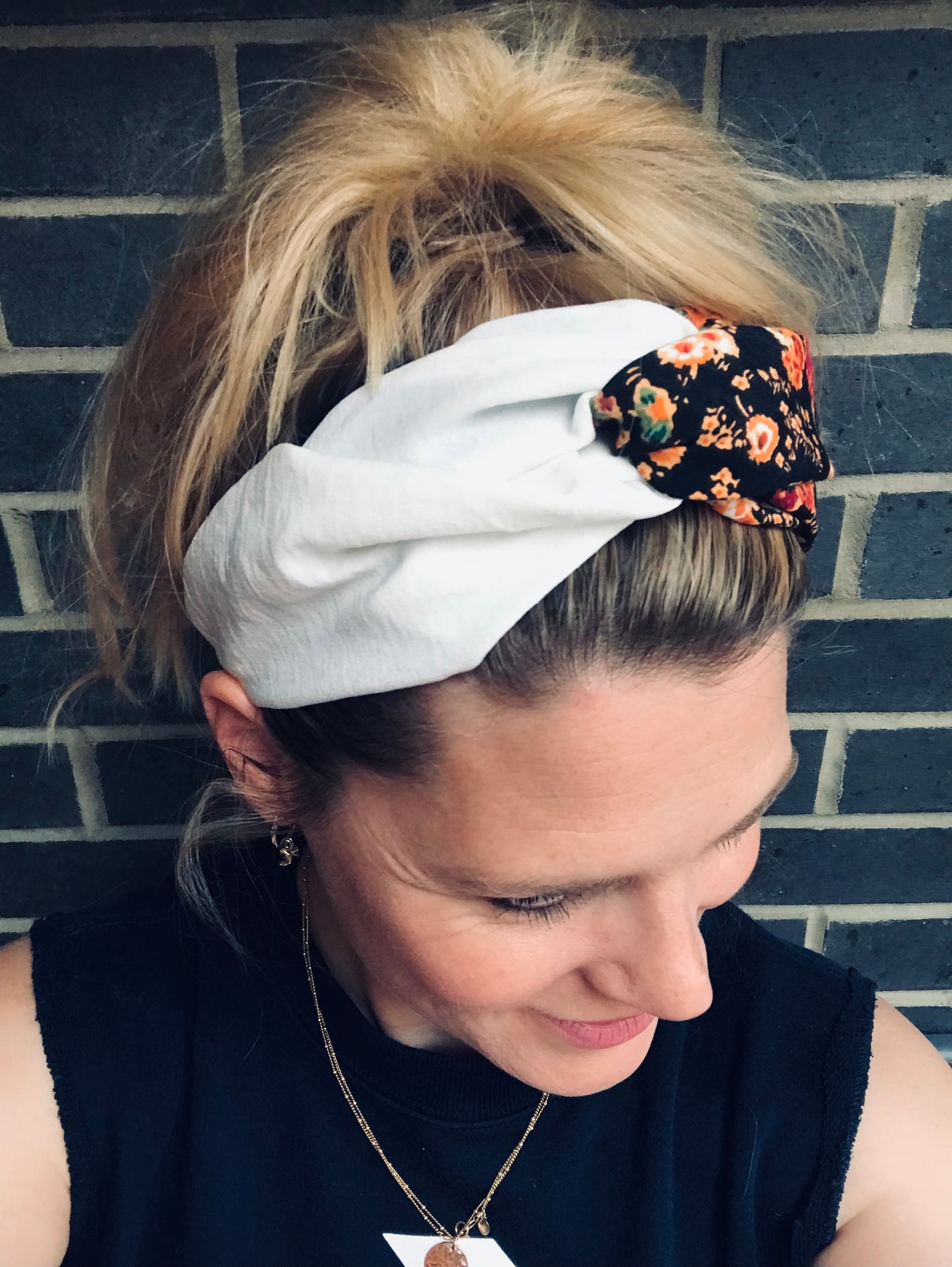 Turban style twist black and orange flowers with cream silk